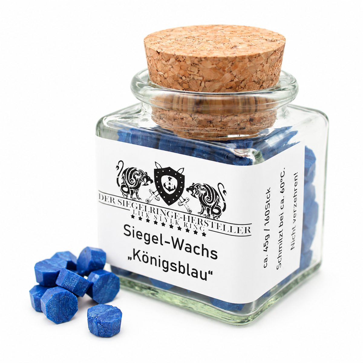 Siegelwachs-Drops koenigsblau im Glas mit Korkverschluss auf weißem Hintergrund